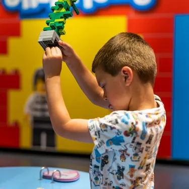 Little boy building with lego