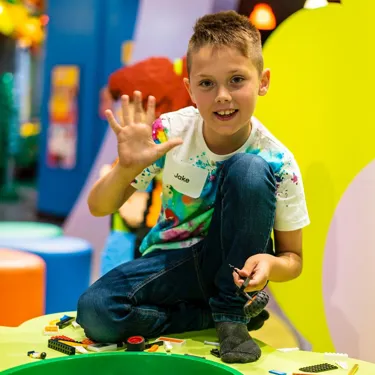 Little boy playing legos