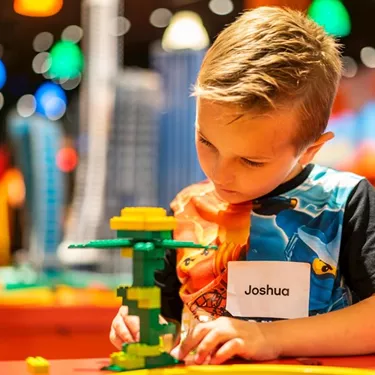 Little boy Joshua playing with lego