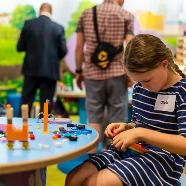 Little girl building with lego