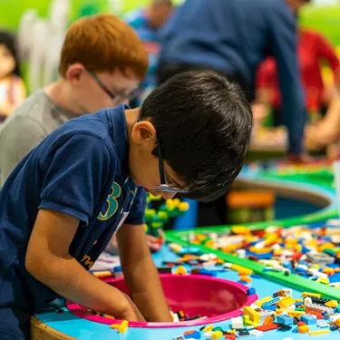 Little boy playing with lego