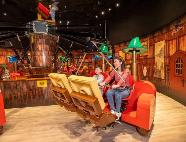 Merlin's Apprentice ride at Legoland Discovery Centre Hong Kong, capturing the enchanting atmosphere of the ride's magical potions chamber.
