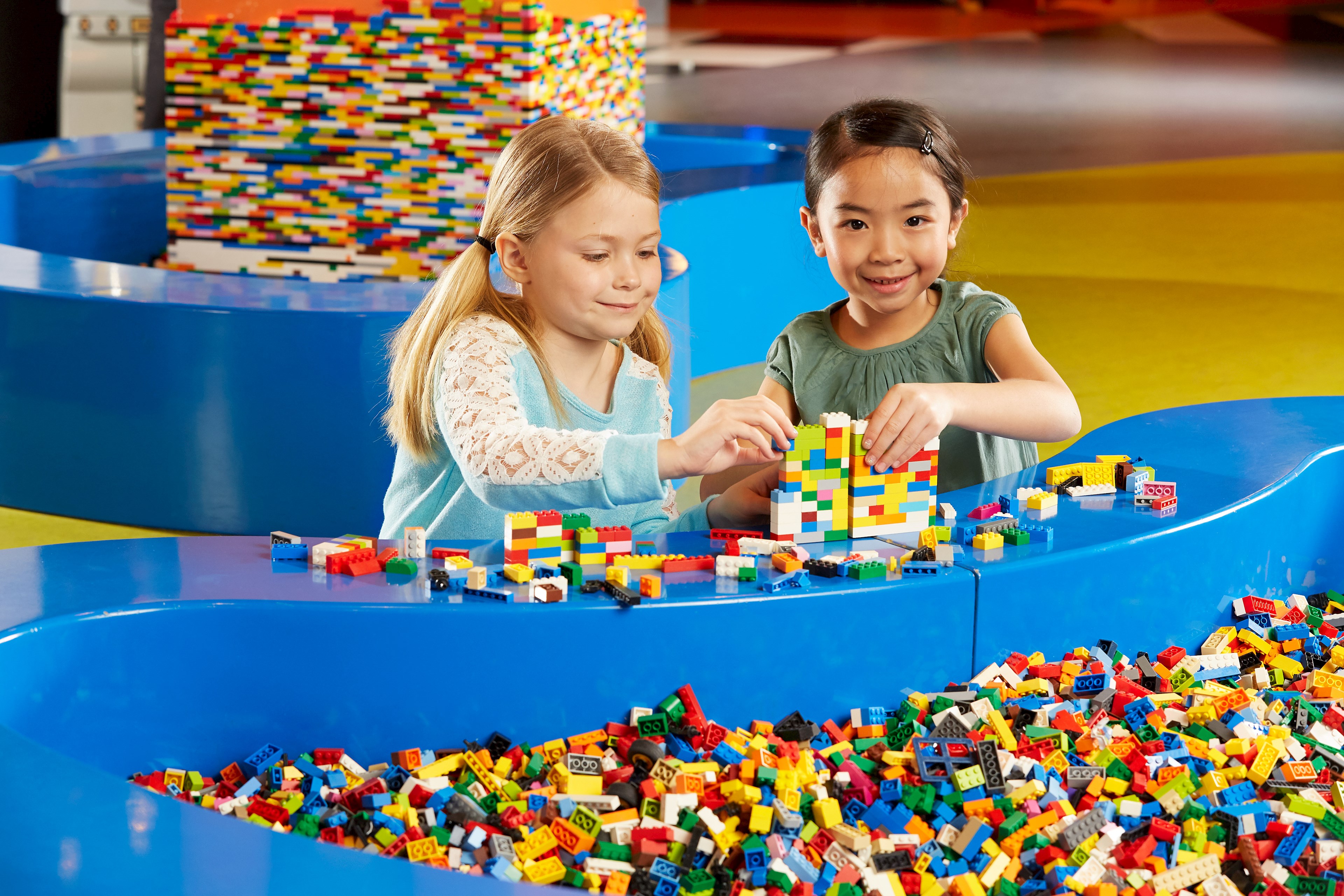 children playing with LEGO