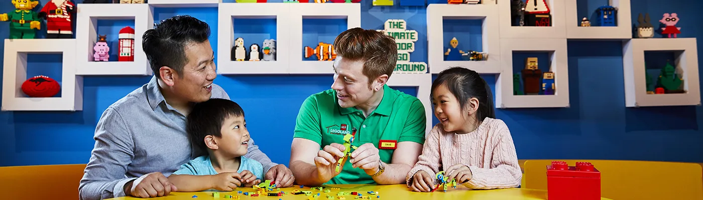 Family building LEGO with staff | LEGOLAND Discovery Center Melbourne