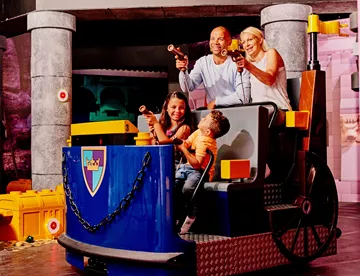 kids and parents on lego ride