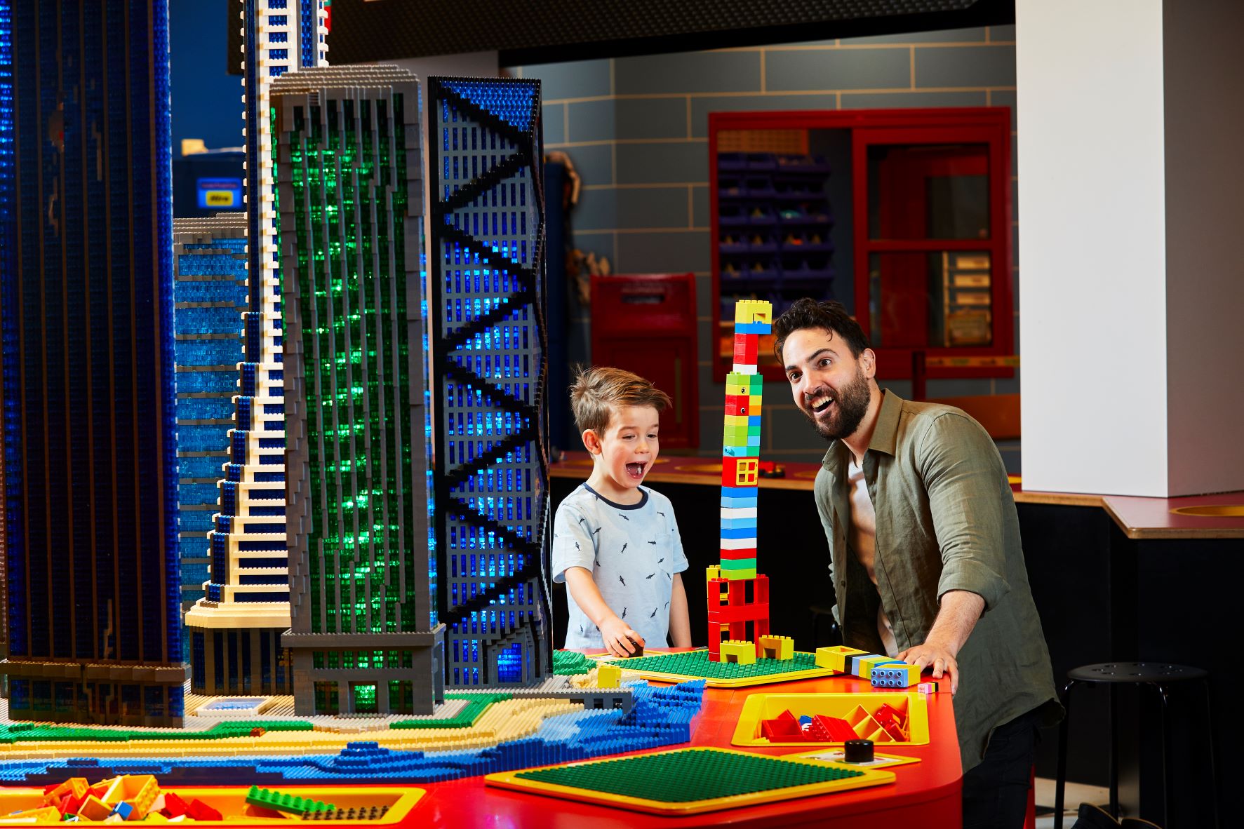 Father and Son building a DUPLO Tower