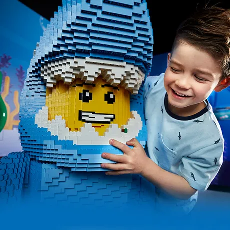 boy with lego figure dressed as shark